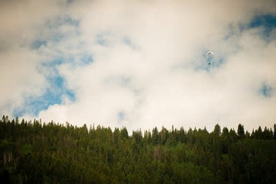 2108c0 20140716 fred child paraglides over aspen