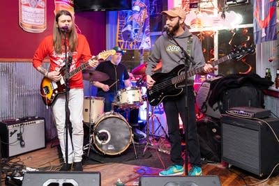 Band performing by window