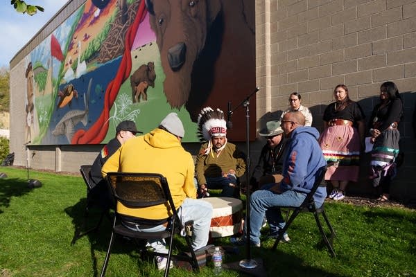 Men take part in a drum circle