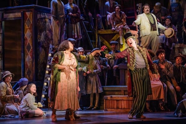 People performing in an opera on a stage