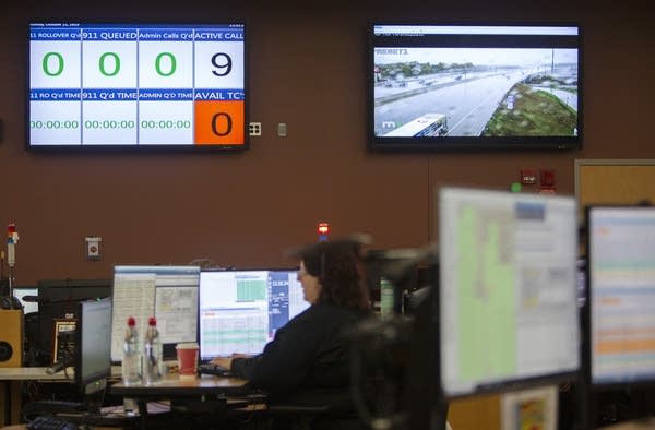 Monitors on a wall. 