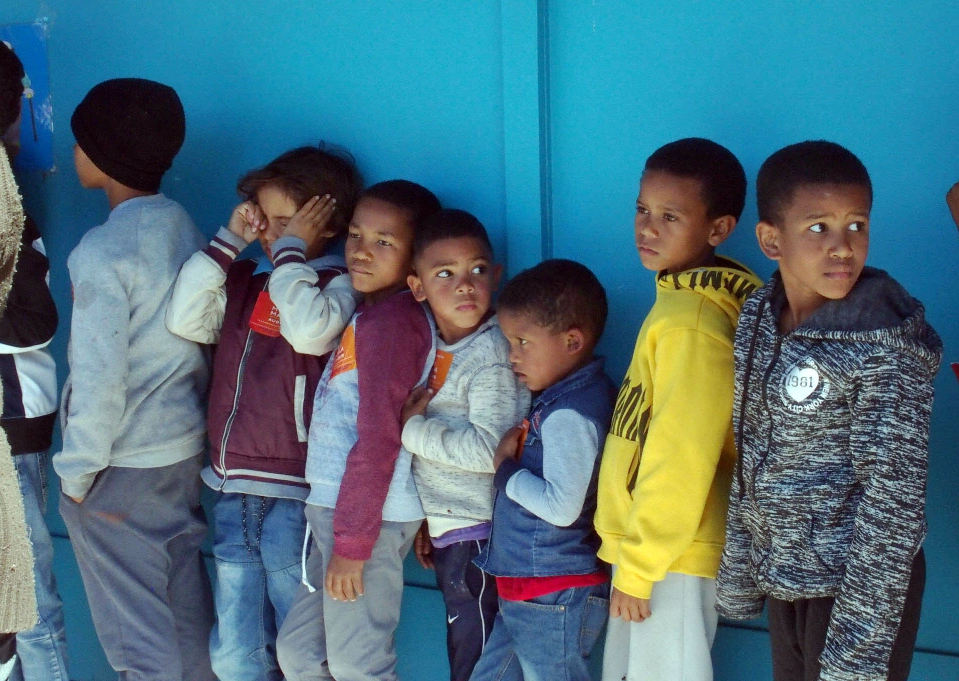 Students and many parents lined up for a bowl of chicken and rice.