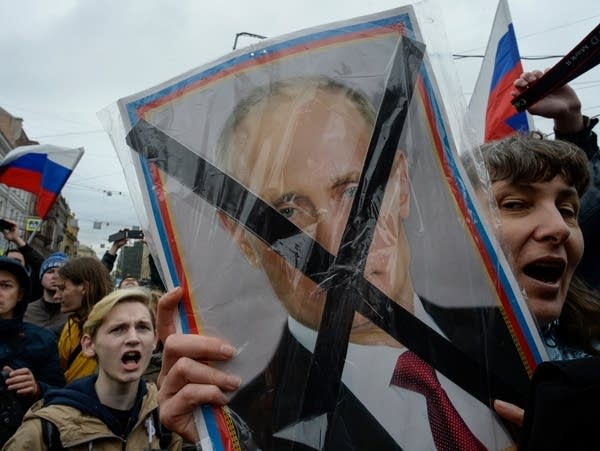 Opposition supporters attend an unauthorized anti-Putin rally