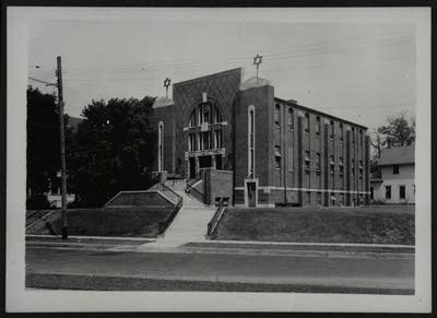 Black and white photo of a synagogue on a hill