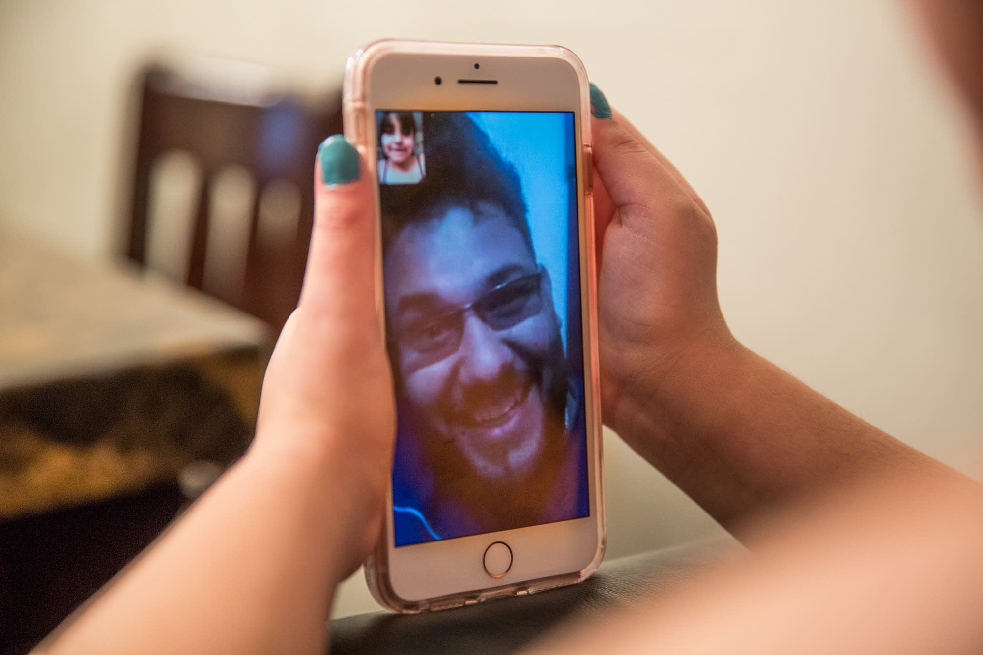 Hasanain video chats with his daughter.