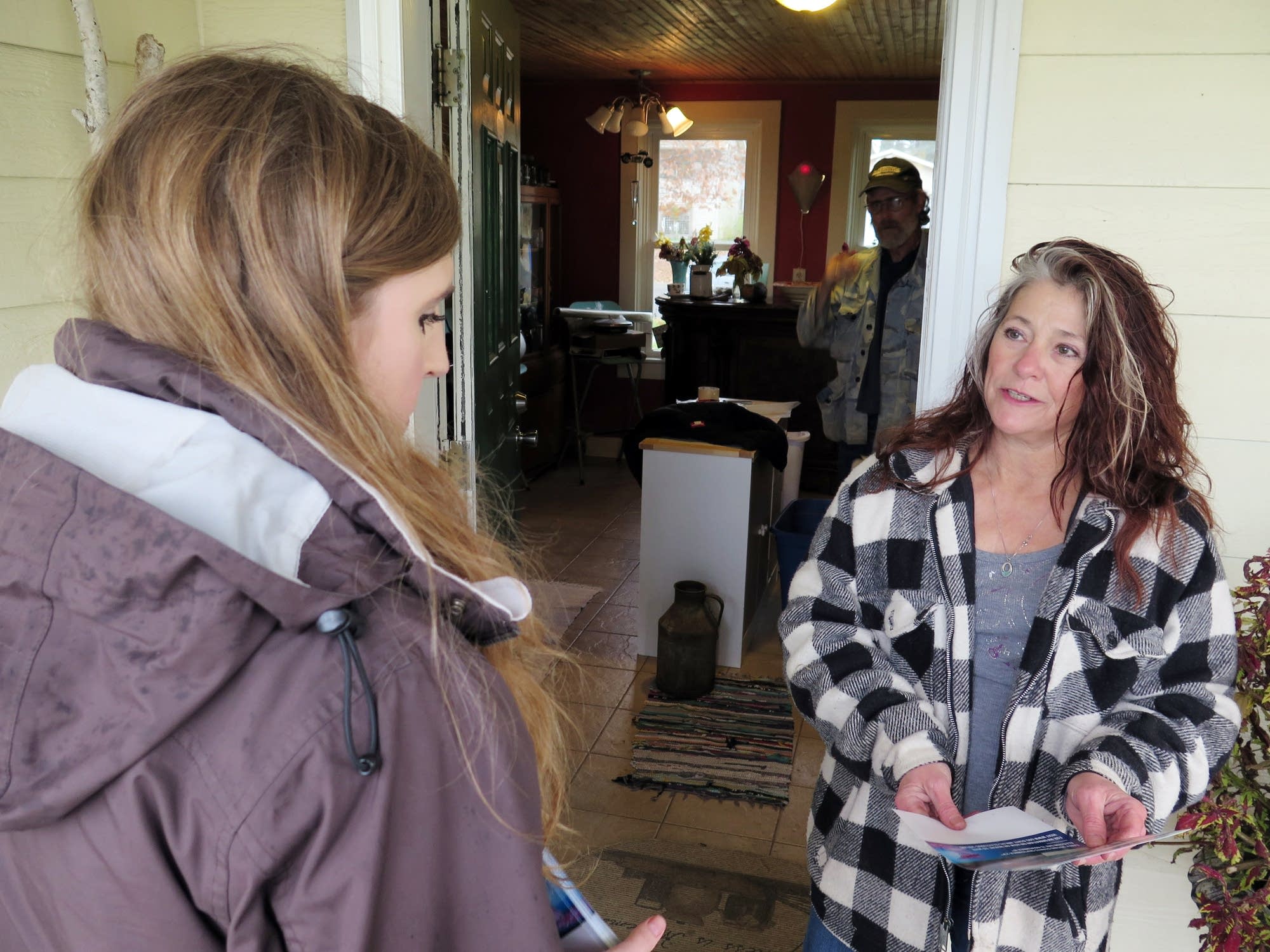 Canvasser Mary Silverthorn, left, talks with Nancy Semmer.