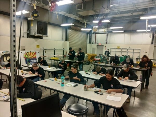 Apprentices in class at Arizona Pipe Trades, a five-year program to train pipefitters, plumbers, and welders outside Phoenix, AZ. 