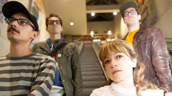 Four members of StoLyette pose for a photograph.