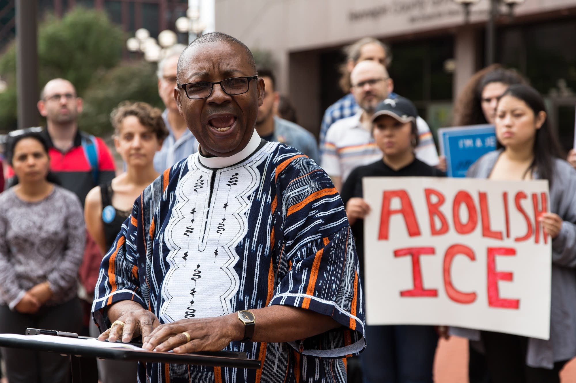 Reverend James N. Willson II speaks to a small crowd during a rally.