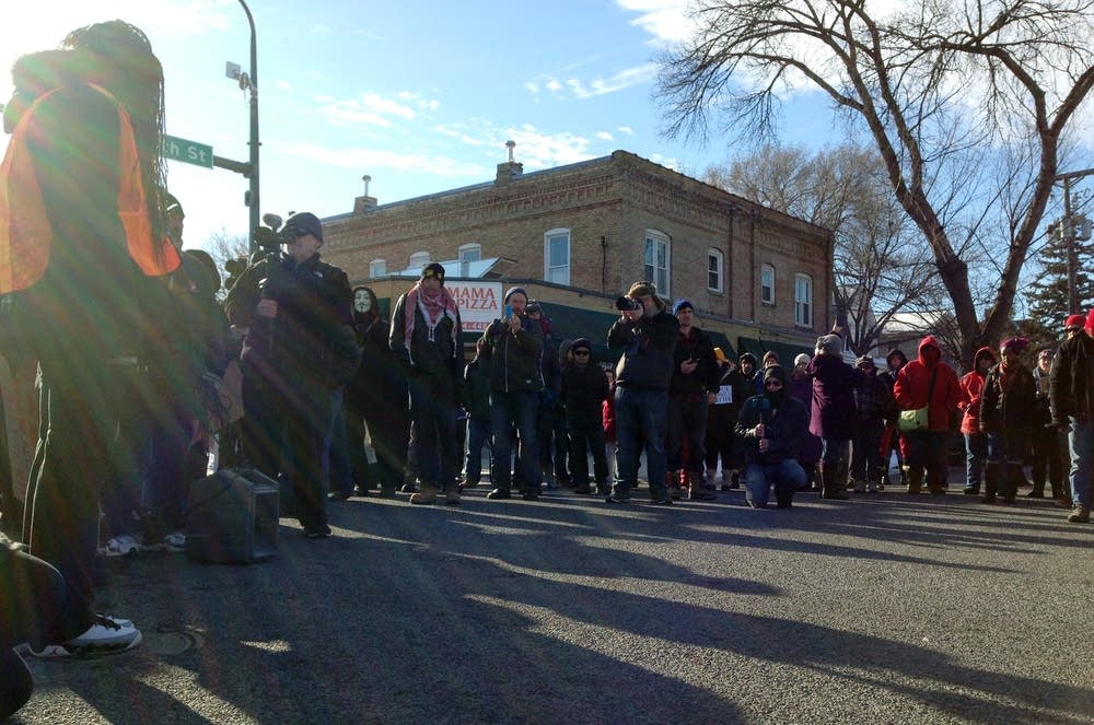 Protesters stand in 34th and Nicollet Aves.