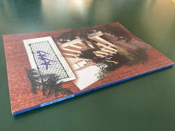 A magazine sits on a green table.