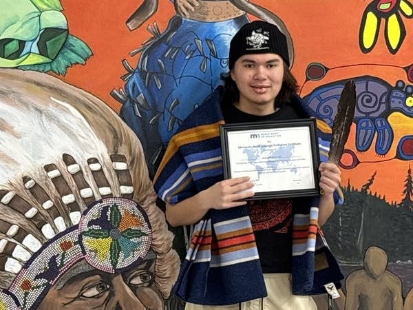 A man holds a certificate