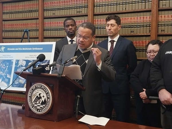 Keith Ellison speaks at a podium.