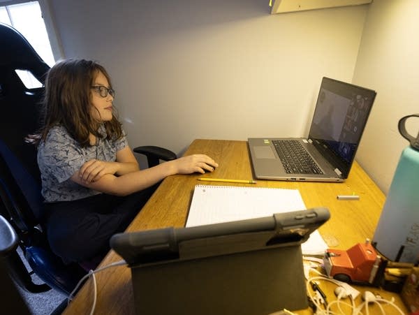 Izzy Beckman listens to instruction at home