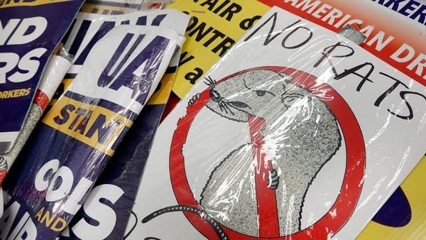 Picket signs for a United Auto Workers rally in October. The UAW is among major unions to reach tentative contracts with employers.