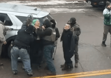 ICE holding a person around the neck
