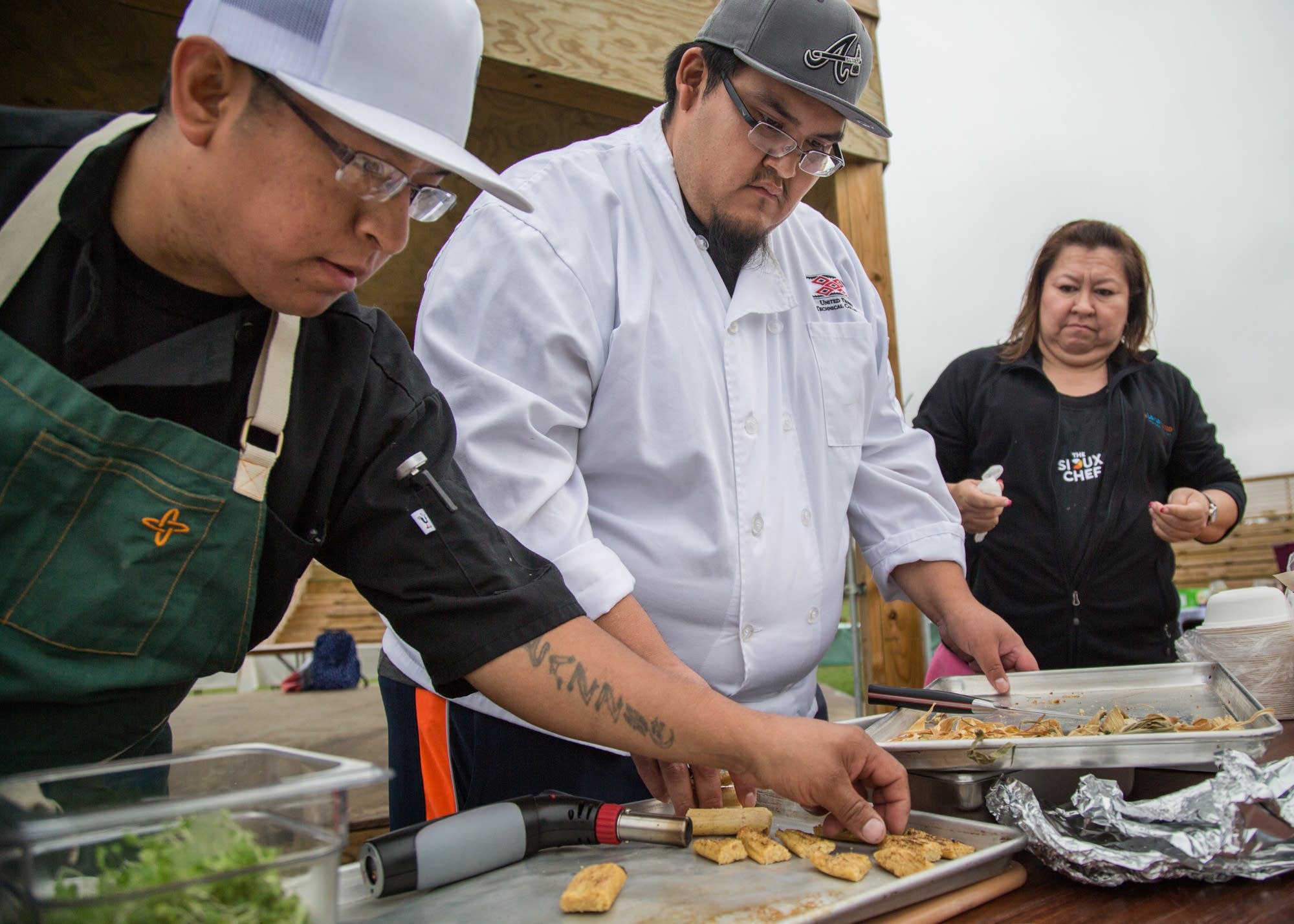 Brian Yazzie (left) helps set up a table.
