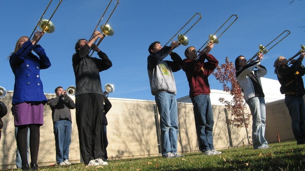Rival high school marching bands combine to survive MPR News