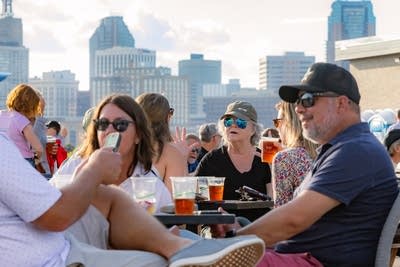 Crowd with skyline behind 