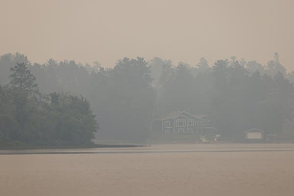 A hazy lakeshore scene