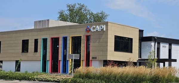A building with CAPI's name and logo on a sunny day