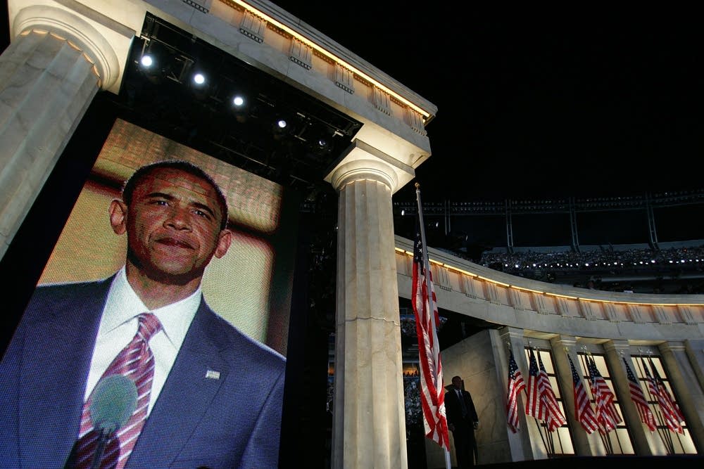 Barack Obama takes the stage at Invesco Field