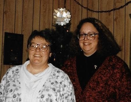Two people pose for a photo