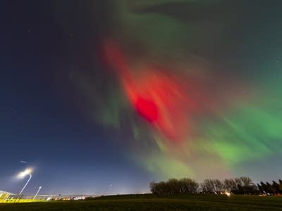 Red and green lights in the night sky