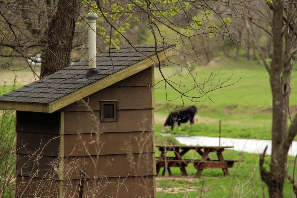 Outhouse and farm alongside the Whitewater River.