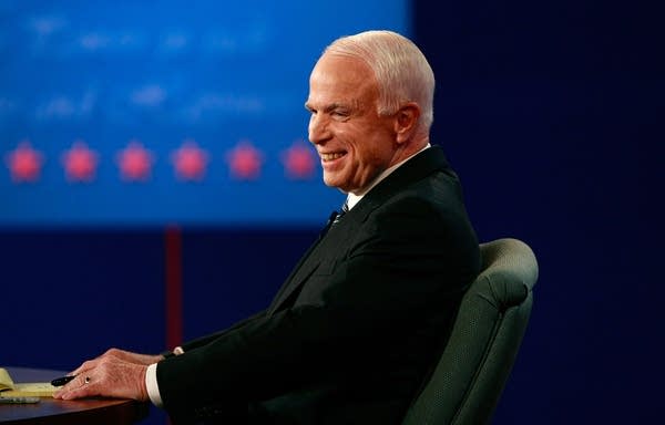 John McCain smiles during the debate