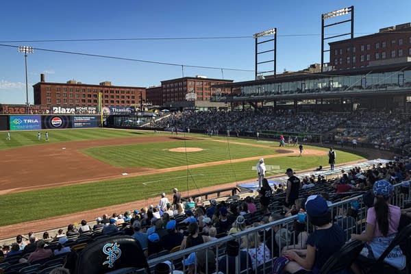 Fans watch the Saint Paul Saints play at CHS Field