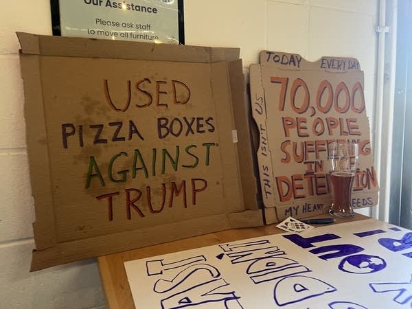 protest signs sit on table