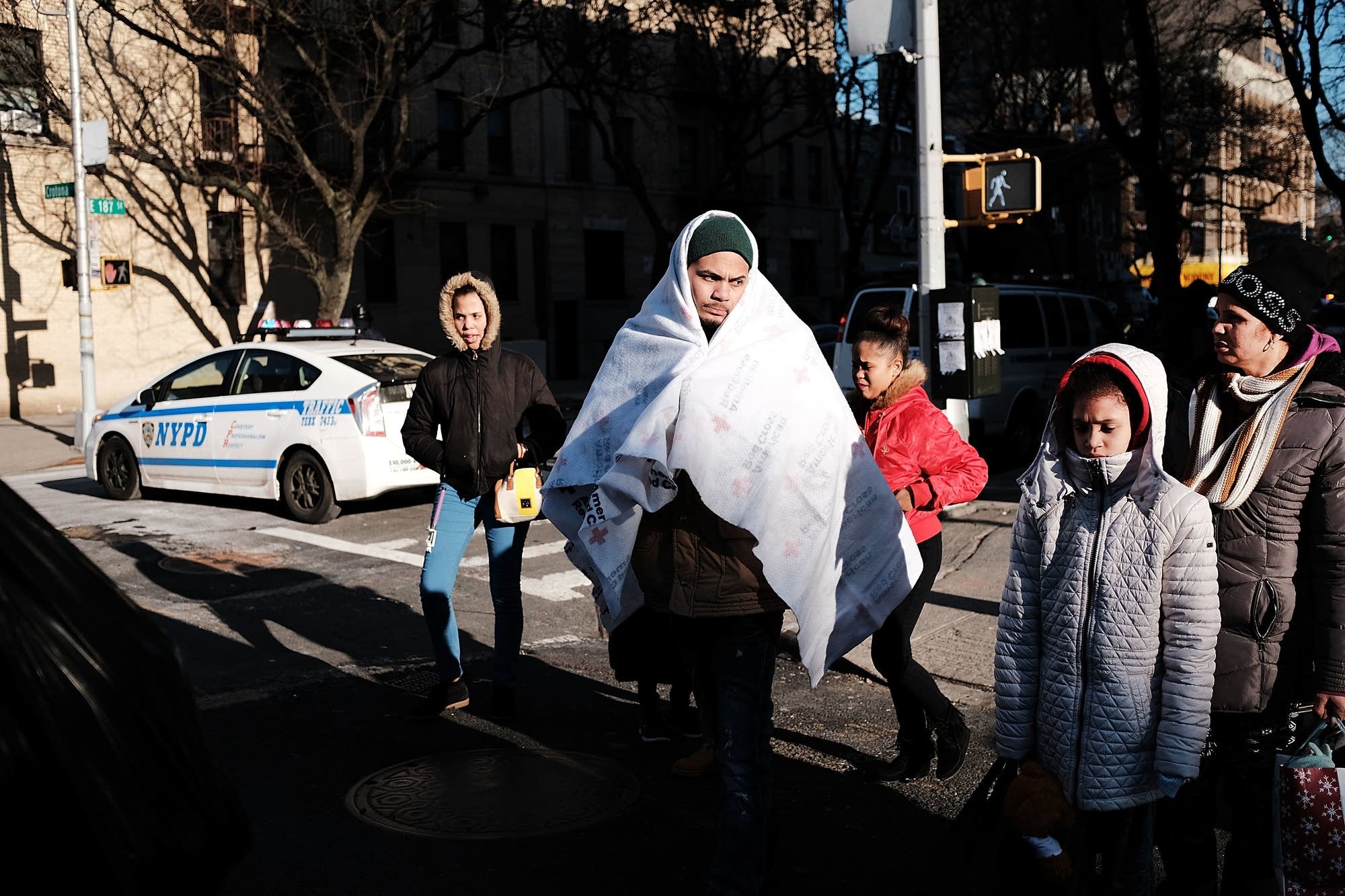 Members of a family who had to evacuate their apartment
