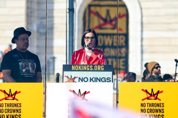 A woman speaks at a podium