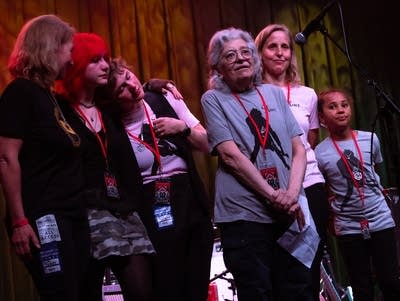 A group of people wearing lanyards.