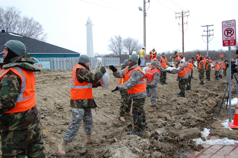 Moving more sandbags into place