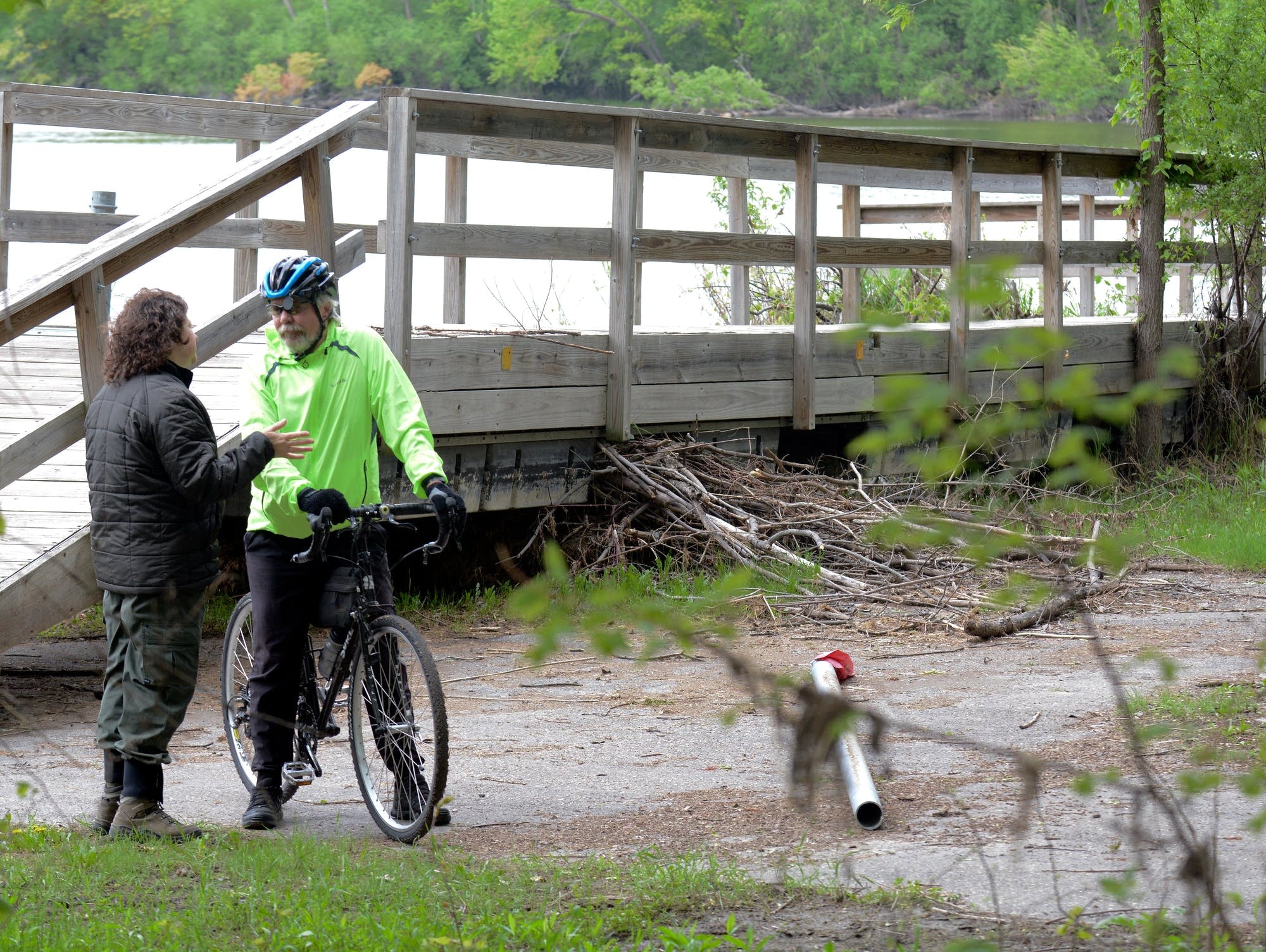 Fort Snelling State Park manager Kelli Bruns talks to a bicyclist