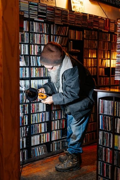 A man looks at CDs in a record store