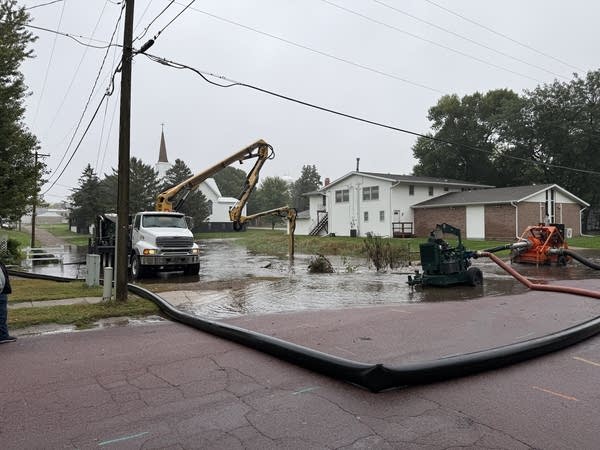 Machines clearing a drain in New Richland