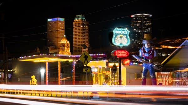 Buck Atom stands watch over Route 66 at night. The 21-foot-tall cowboy has helped attract tourists to the area.
