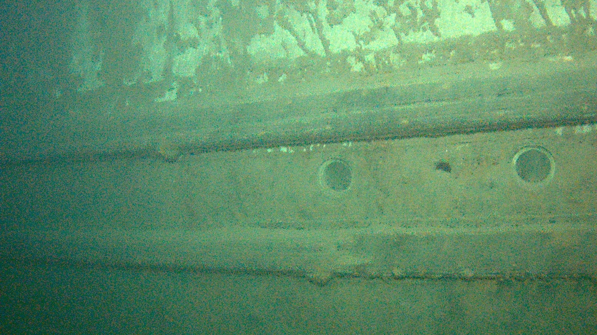 Portholes are seen in the hull of the wrecked freighter Hudson
