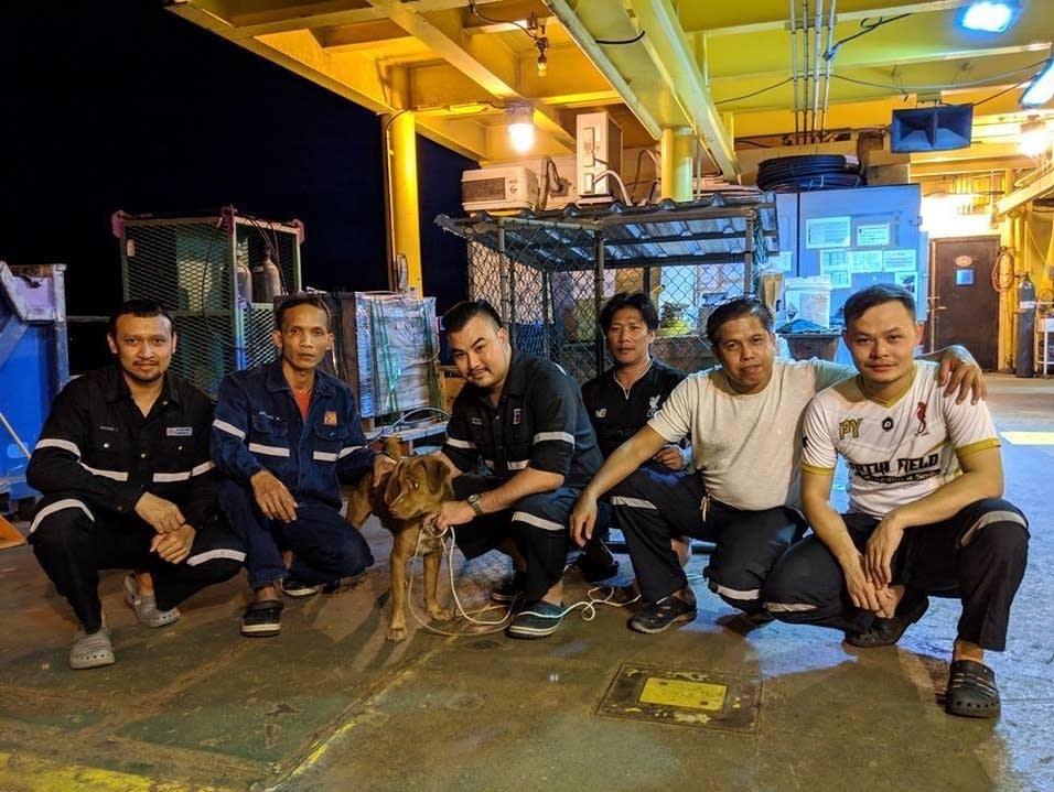 Boonrod poses with oil rig workers in the Gulf of Thailand.