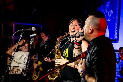 A rock band performing onstage