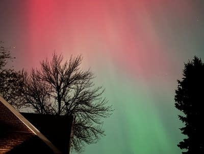 Red and green lights cover the night sky.