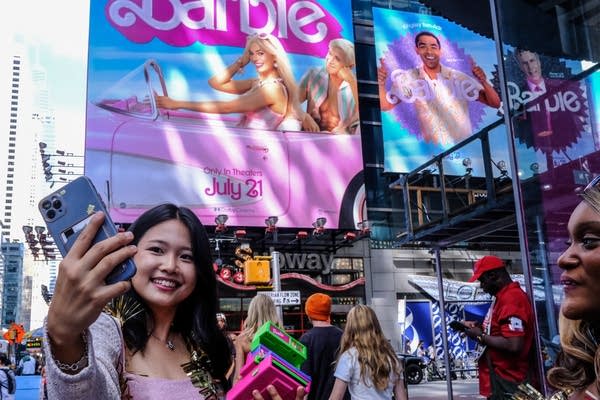 NEW YORK, NEW YORK - JULY 21: People dress up as the doll Barbie to attend the Barbie movie on July 21, 2023 in New York City.  On the opening day, director Greta Gerwig's film "Barbie" sparked a Barbie-mania among fans who flocked to the theaters wearing their favorite Barbie-inspired attire.