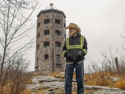 Alan Sparhawk poses for a photo wearing a cowboy hat near Enger Tower in Duluth.