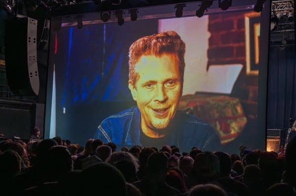 The Suicide Commandos' bassist Steve Almaas projected on the First Avenue screen