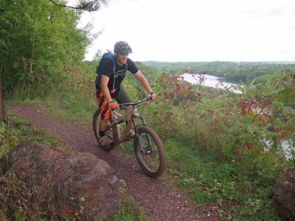 Aaron Hautula bikes to the top of Miner's Mountain