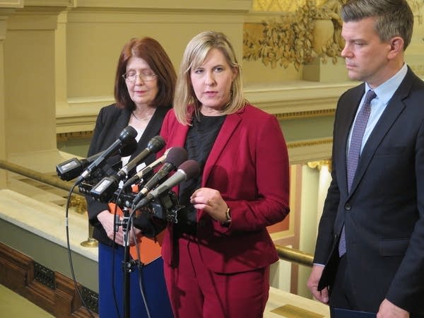 Two women at a podium