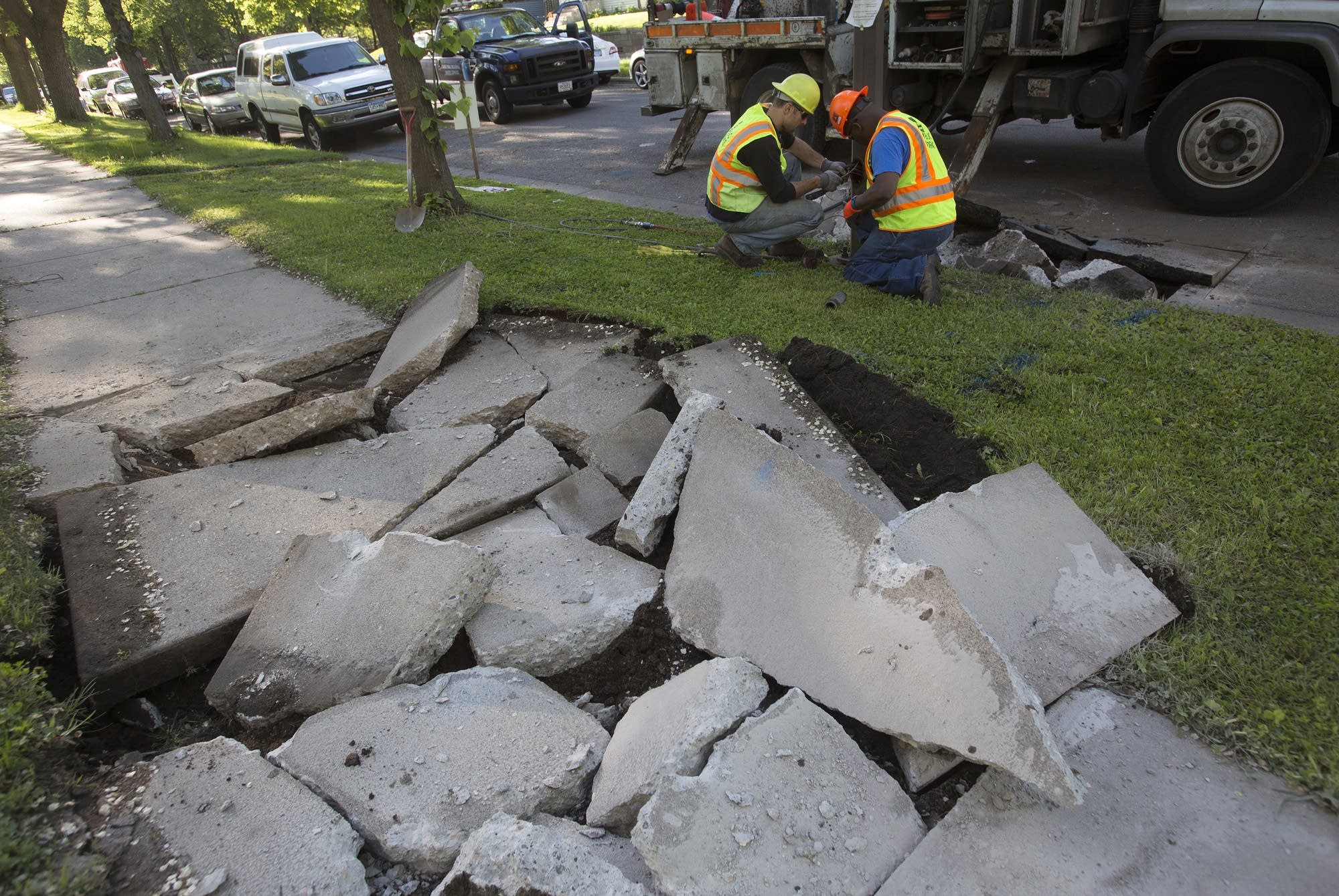Workers replace water pipes.